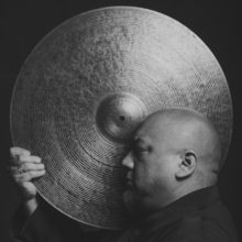 Asian artist with gong