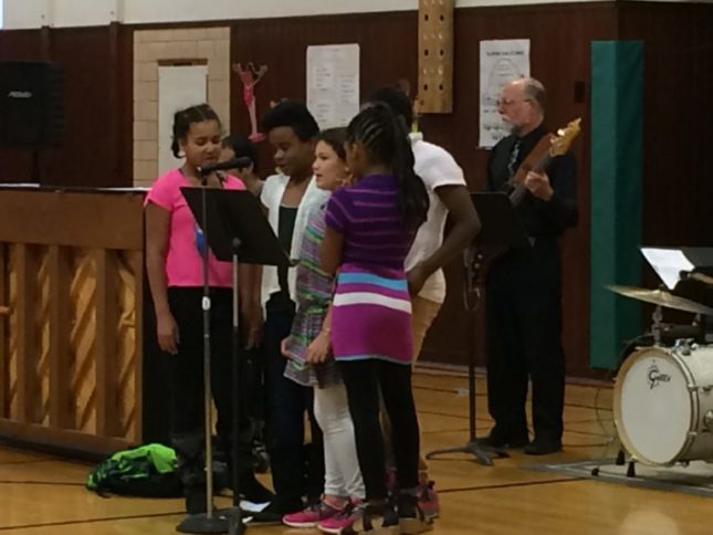 Garfield kids in after school program singing