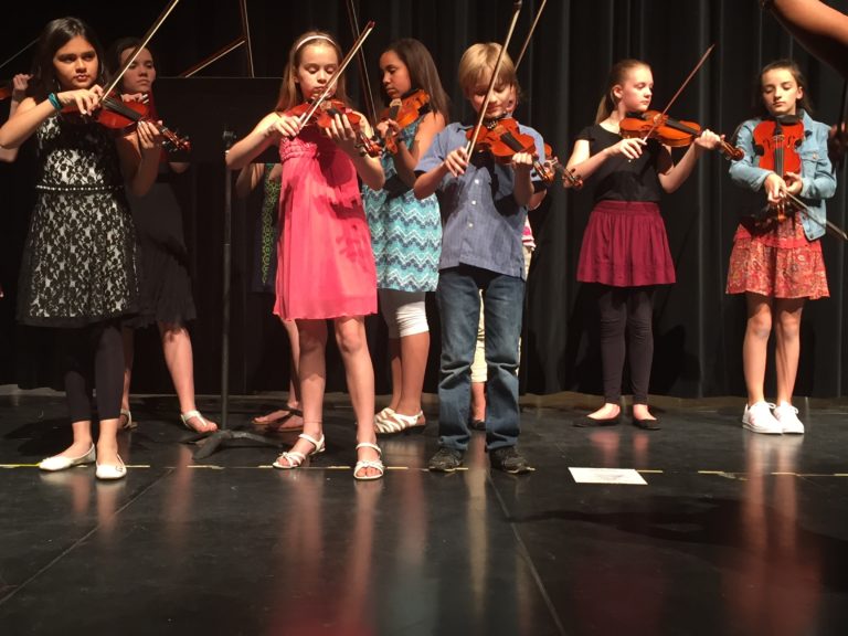 Children playing violins